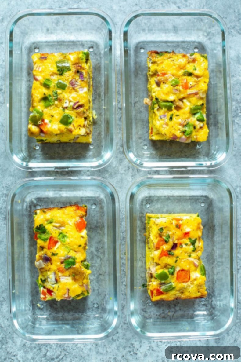 This Sausage Hashbrown Breakfast Casserole is made healthier thanks to turkey breakfast sausage and less cheese - it's a great meal prep idea that is also freezer-friendly! Individual servings of baked egg casserole in glass meal prep containers, ready for convenient weekly meals.
