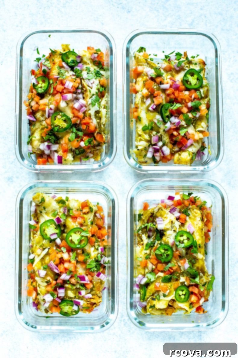 This Chicken Enchiladas Verdes recipe is made with tomatillo-based salsa verde and comes together as an easy dinner casserole - it also works great as flavorful meal prep lunches! #greenenchiladas #enchiladasverdes #chicken Four individual meal prep containers filled with delicious Green Chicken Enchiladas, ready for the week.
