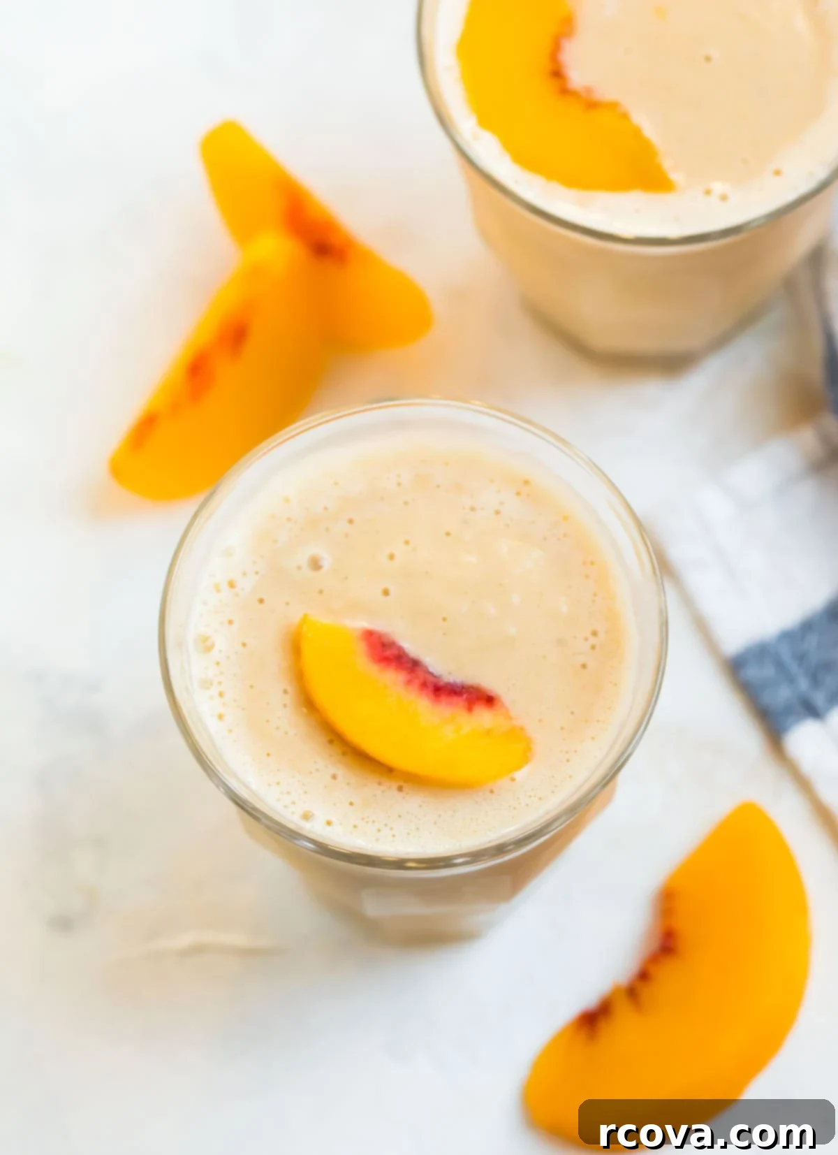 Power-Packed Protein Blends for Wellness 19 Peach Smoothie via Well Plated by Erin, a sweet and creamy fruit blend.