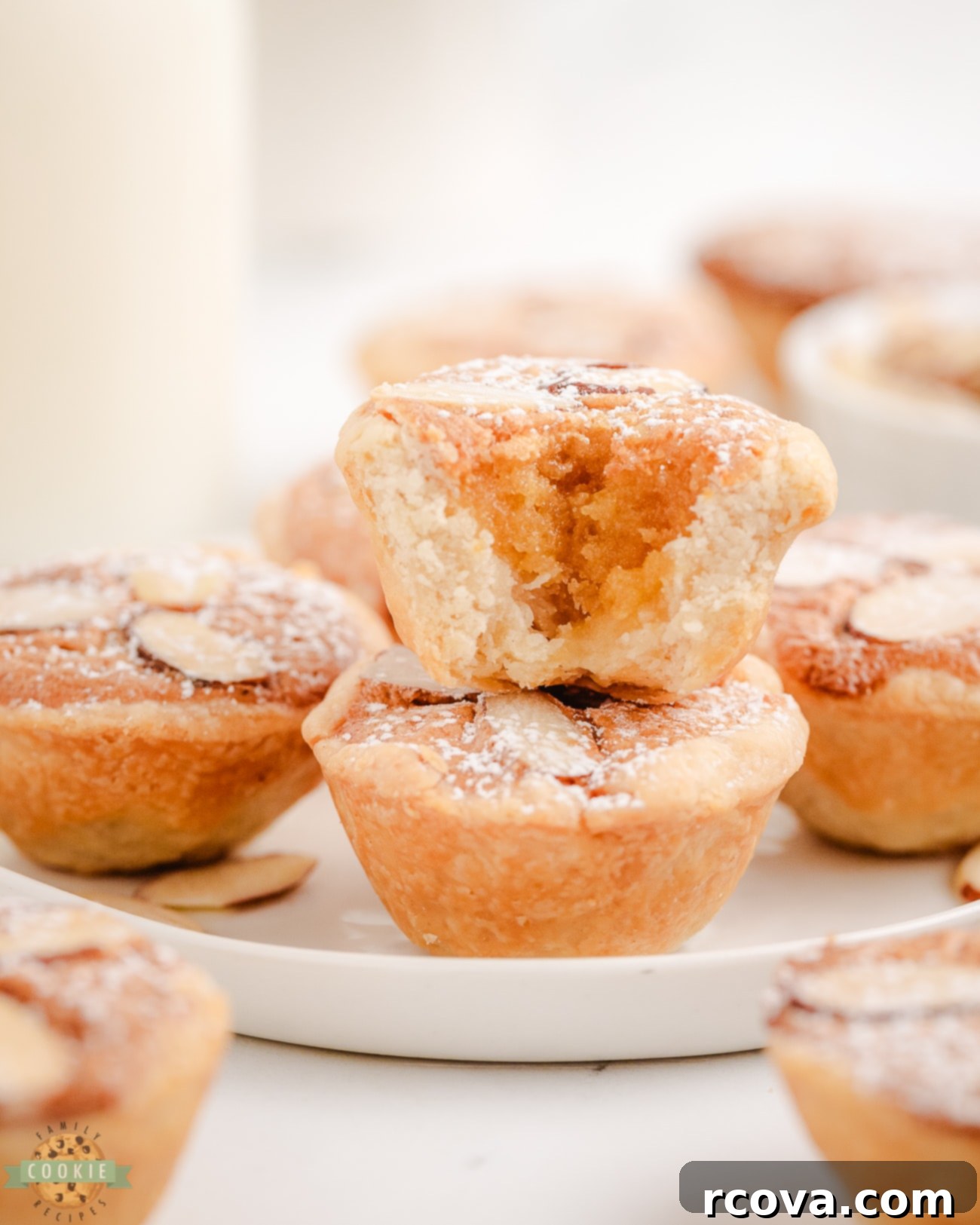 Dutch Almond Cookie Bites 3 A baked Dutch Almond Cookie Cup with a bite taken out, revealing the soft almond filling