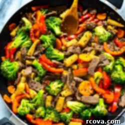 Simple and Savory Beef Stir Fry 6 Beef stir fry in a black skillet, ready to serve.