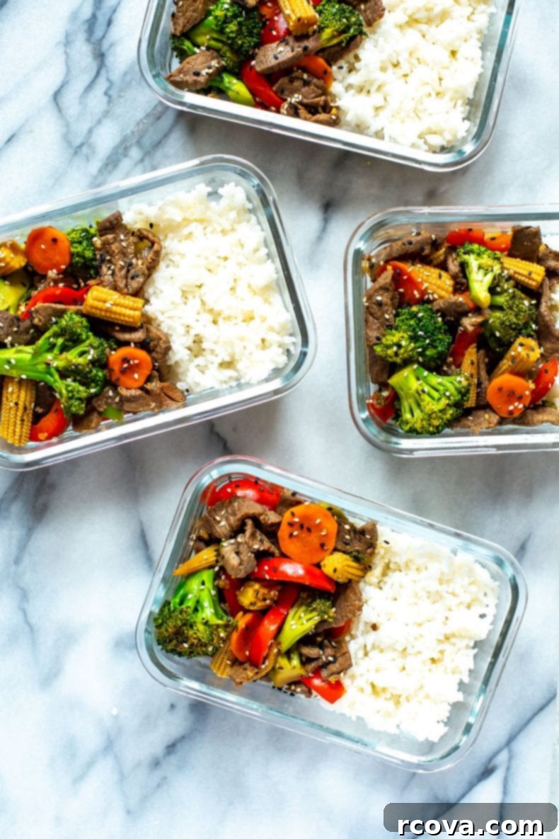 This is the EASIEST Beef Stir Fry recipe out there - with a simple 2-ingredient sauce, you'll likely already have all the ingredients you need to make this healthy dinner idea! #beefstirfry #skilletrecipe Meal prep containers with Beef Stir Fry including broccoli, baby corn, red bell peppers and beef slices
