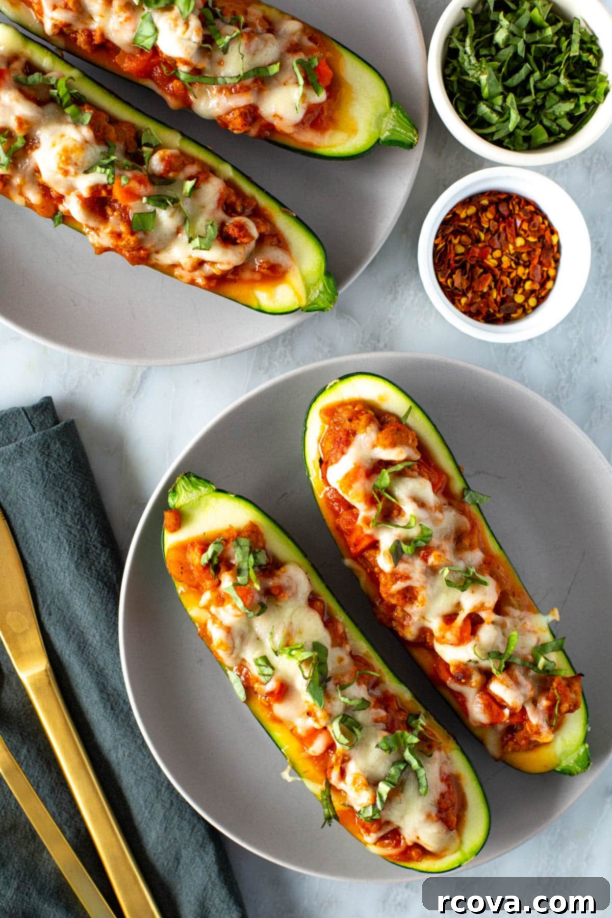 Quick and Flavorful Italian Zucchini Boats 8 A perfectly cooked Italian stuffed zucchini boat, golden-brown and steaming, presented on a plate, ready to eat.