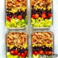Effortless Two Ingredient Salsa Chicken 8 Four meal prep containers, each containing crockpot salsa chicken, corn, black beans, cherry tomatoes and lettuce.