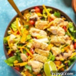 Homemade McDonald's Southwest Salad Recipe 10 A close-up of a bowl of Copycat McDonald's Southwest Salad with a fork in it.