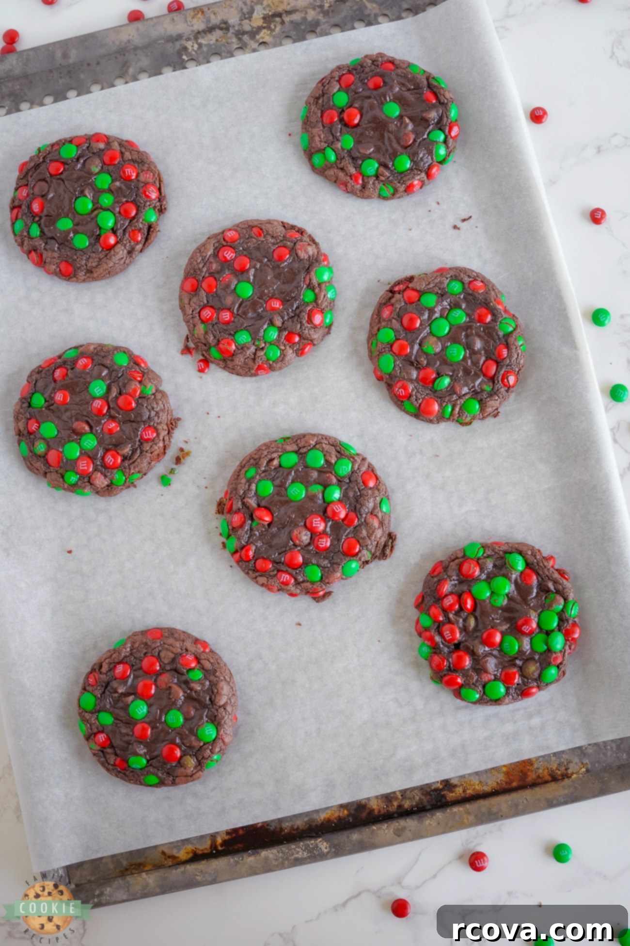 Christmas M&M Brownie Cookies 4 Christmas brownie cookies on a baking sheet