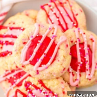 Valentines Thumbprint Cookies 12 Valentine’s Thumbprint Cookies with pink and red chocolate filling and sprinkles.