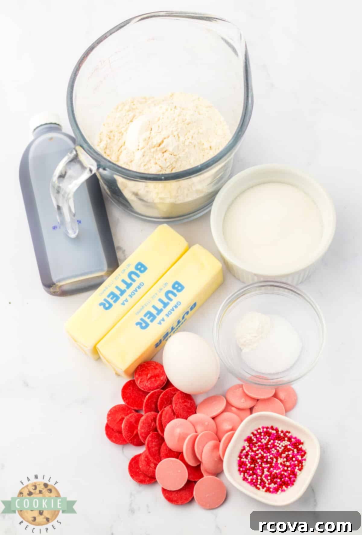 Valentines Thumbprint Cookies 3 Ingredients for Valentine's Thumbprint Cookies including butter, sugar, egg, vanilla, flour, baking powder, sprinkles, and candy melts.