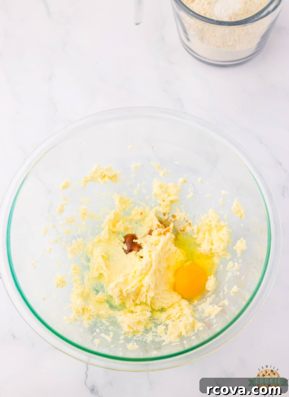 Valentines Thumbprint Cookies 5 Mixing butter, sugar, egg and vanilla together for cookie dough.