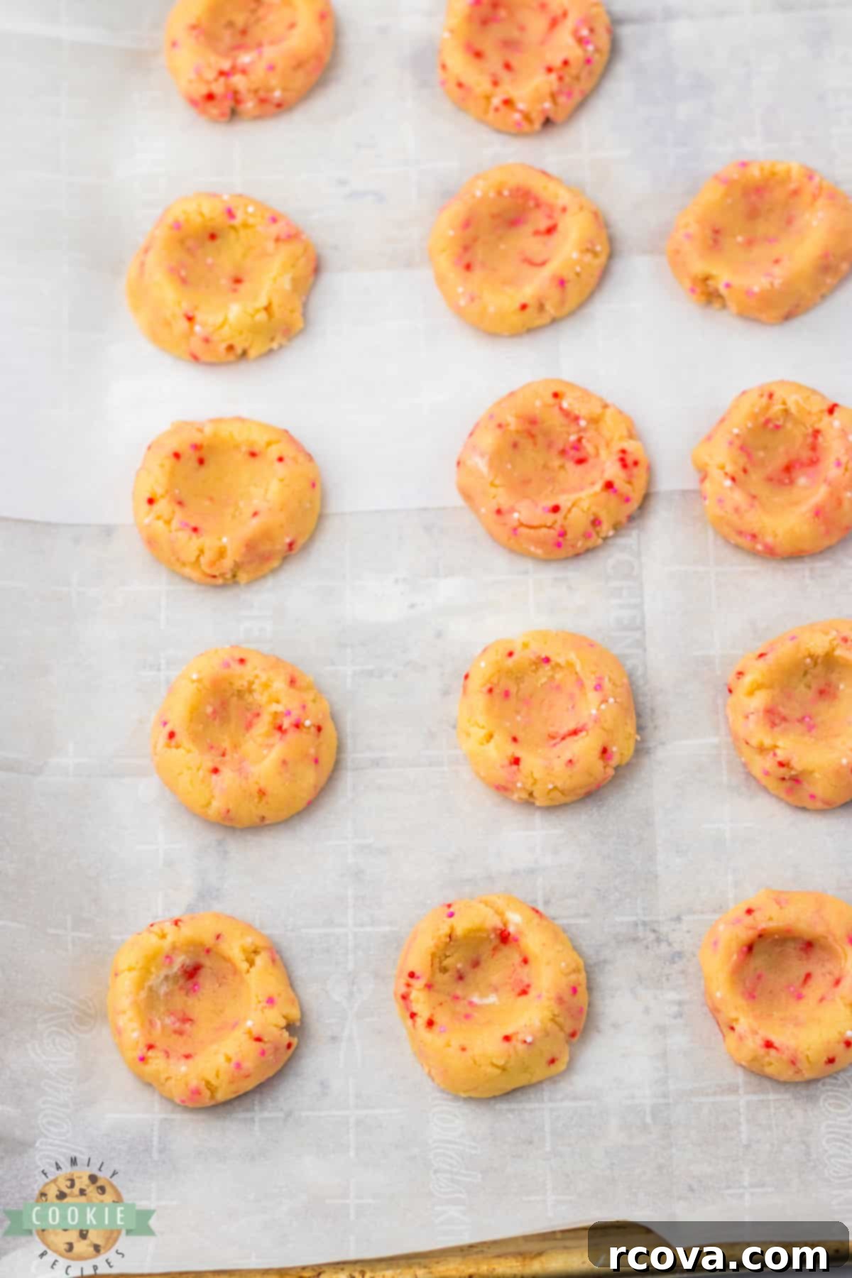 Valentines Thumbprint Cookies 7 Shaping thumbprint cookies before baking by creating an indent with a thumb.
