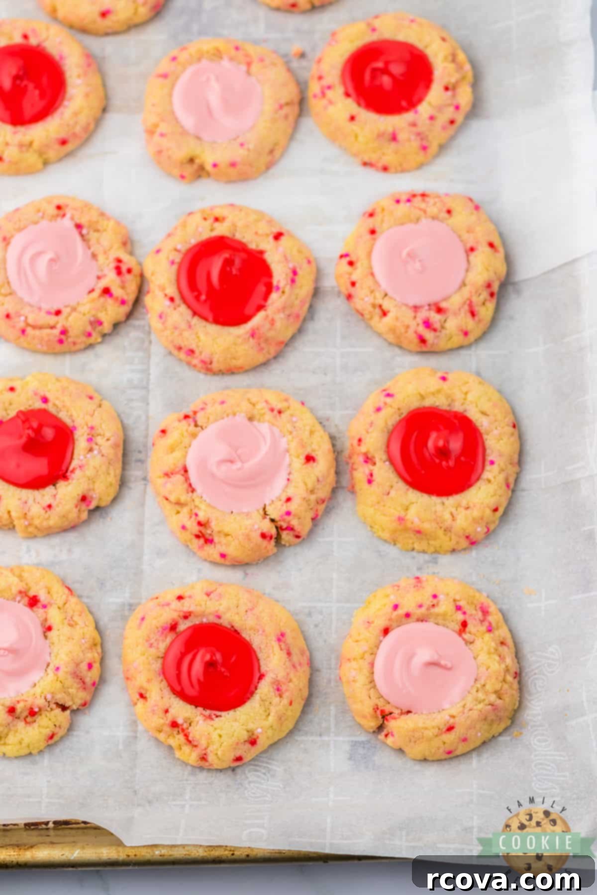 Valentines Thumbprint Cookies 9 Filling thumbprint cookies with melted red and pink chocolate.