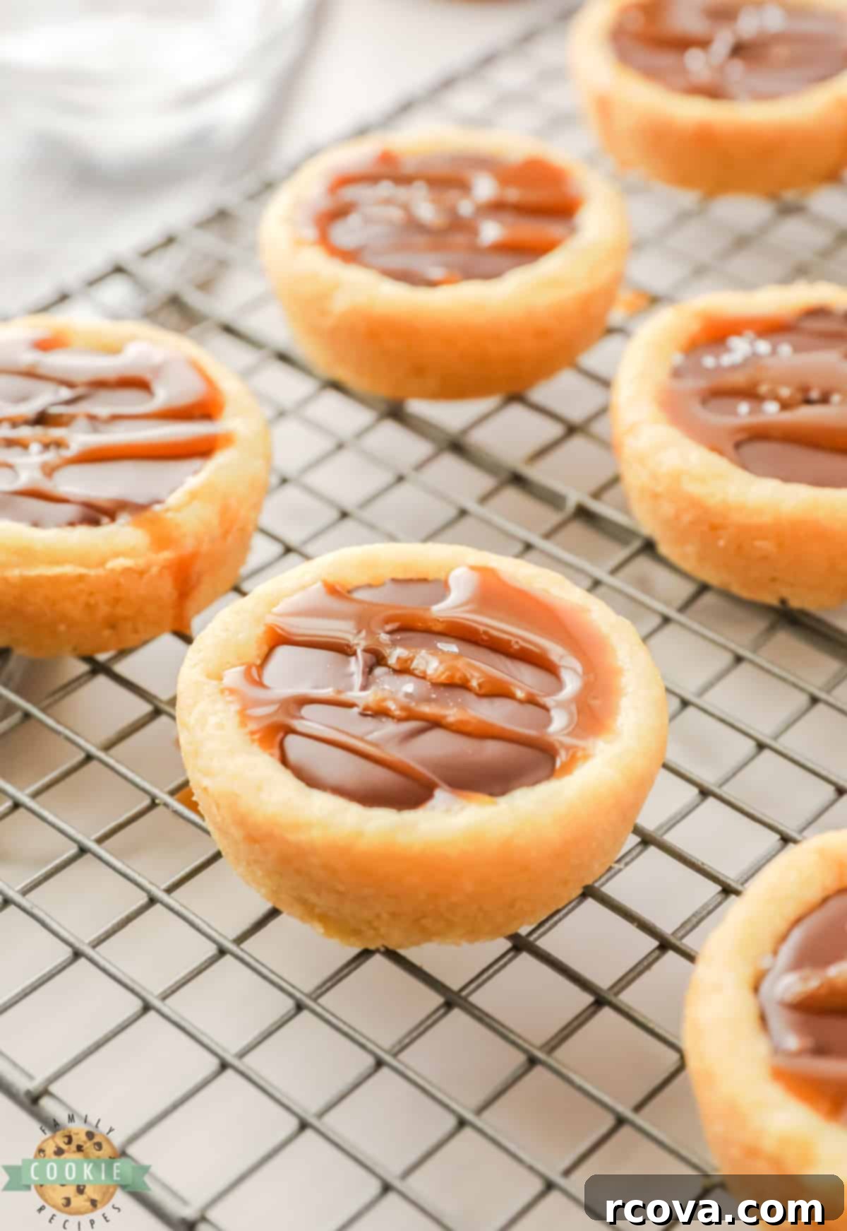 Decadent Twix Cookie Cups 3 Sugar cookie cup filled with chocolate and caramel.