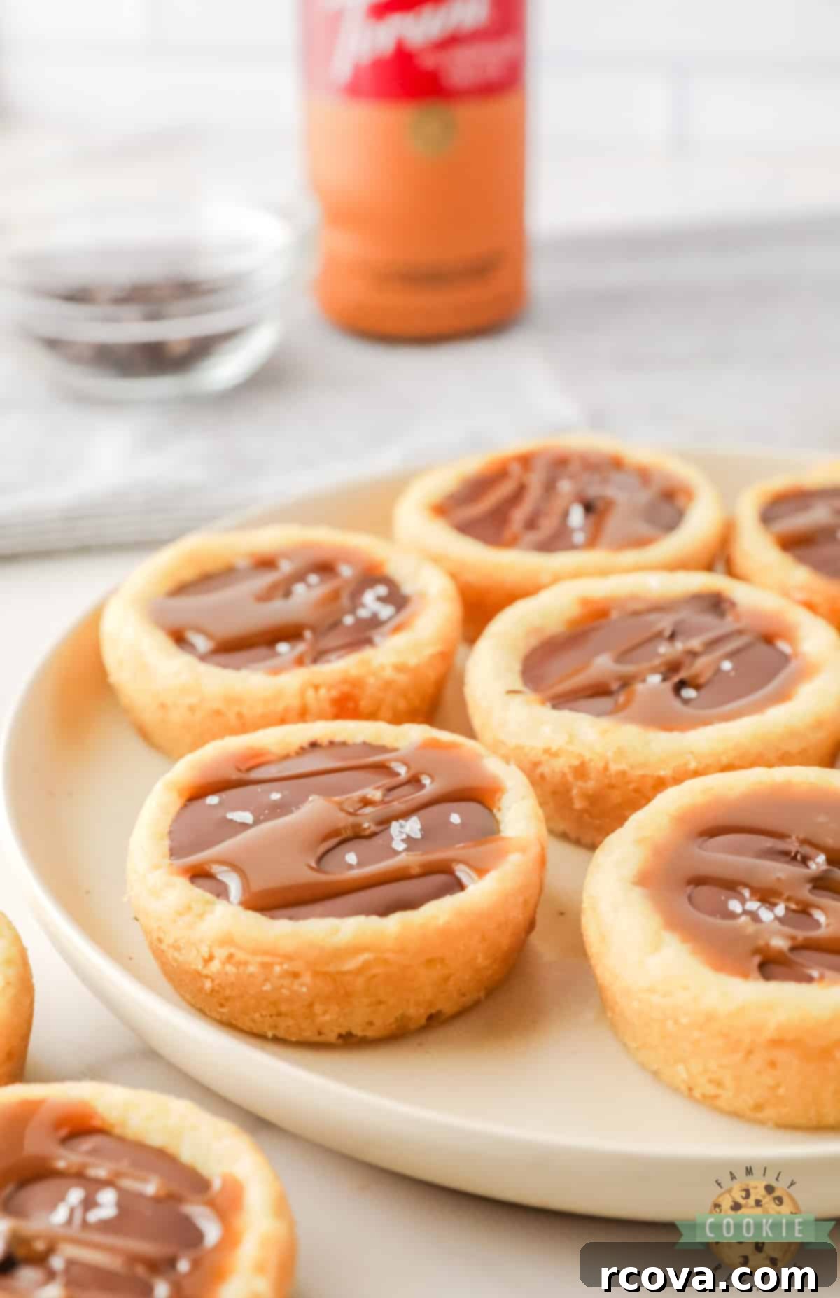 Decadent Twix Cookie Cups 10 Sugar cookie cup filled with caramel and chocolate.