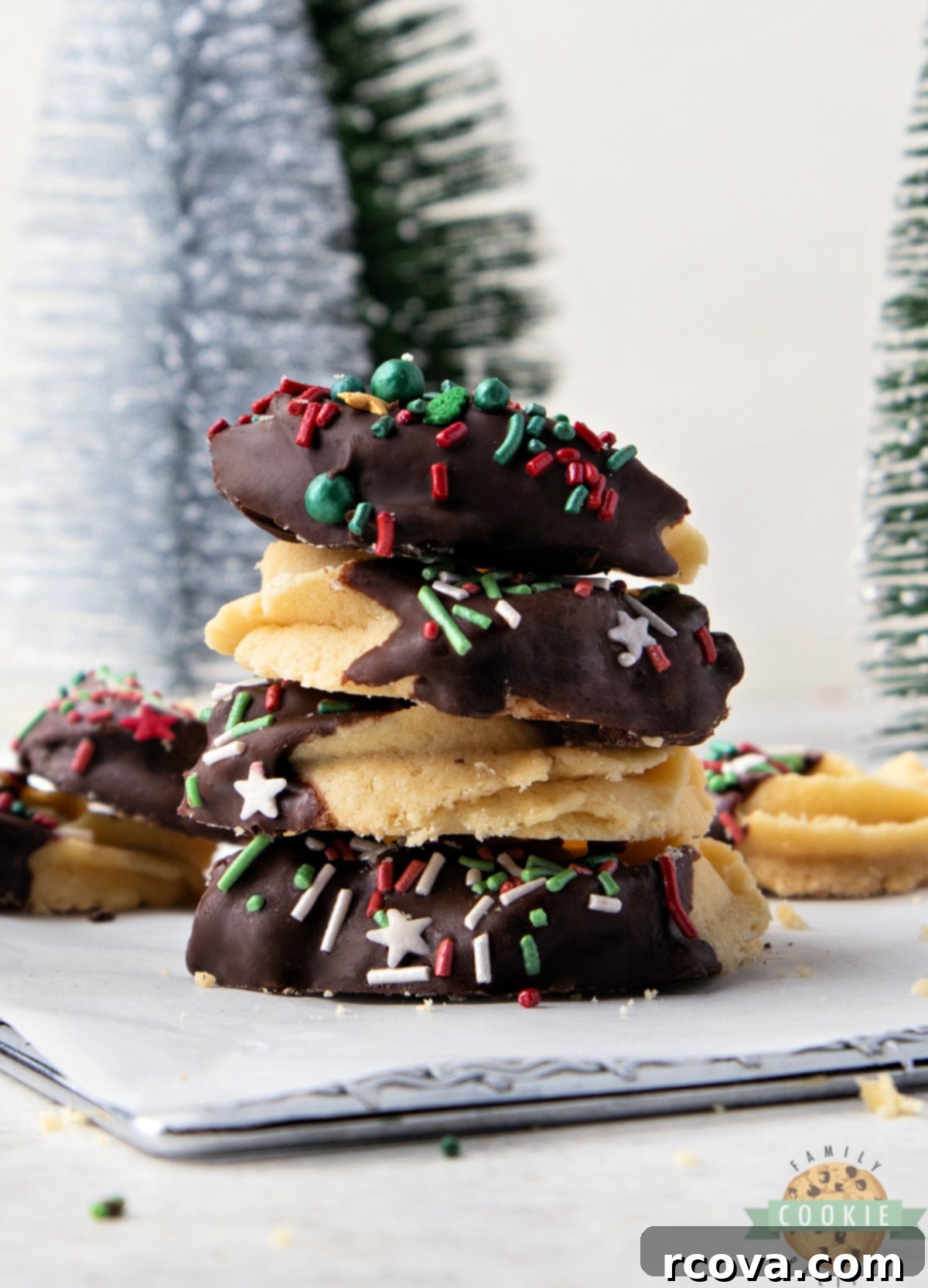 Classic Holiday Butter Cookies 3 Butter cookie recipe dipped in chocolate. Decorated with red and green sprinkles for Christmas.