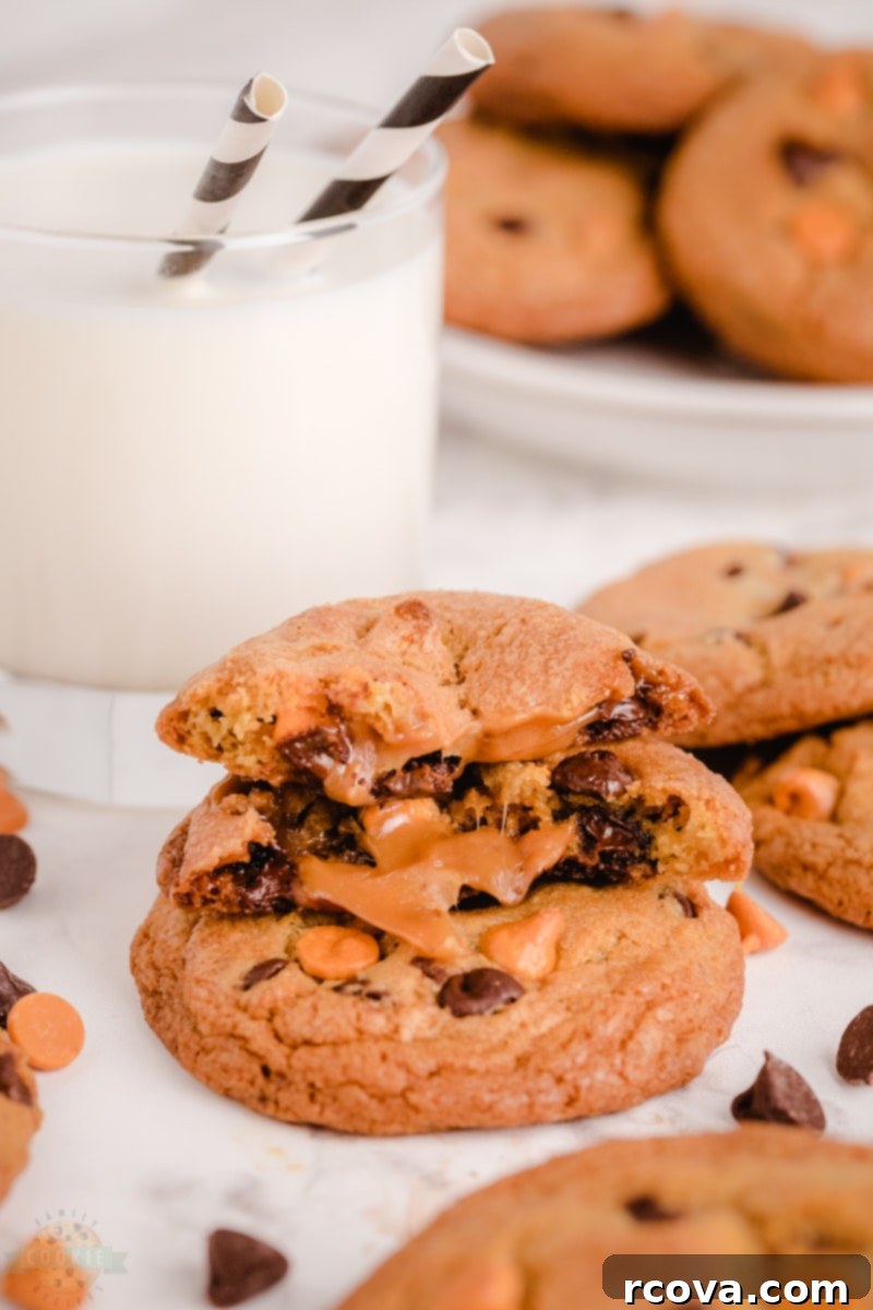 Chocolate Chip Cookies with a Gooey Caramel Heart 5 A plate of freshly baked Caramel Chocolate Chip Cookies with a glass of milk.