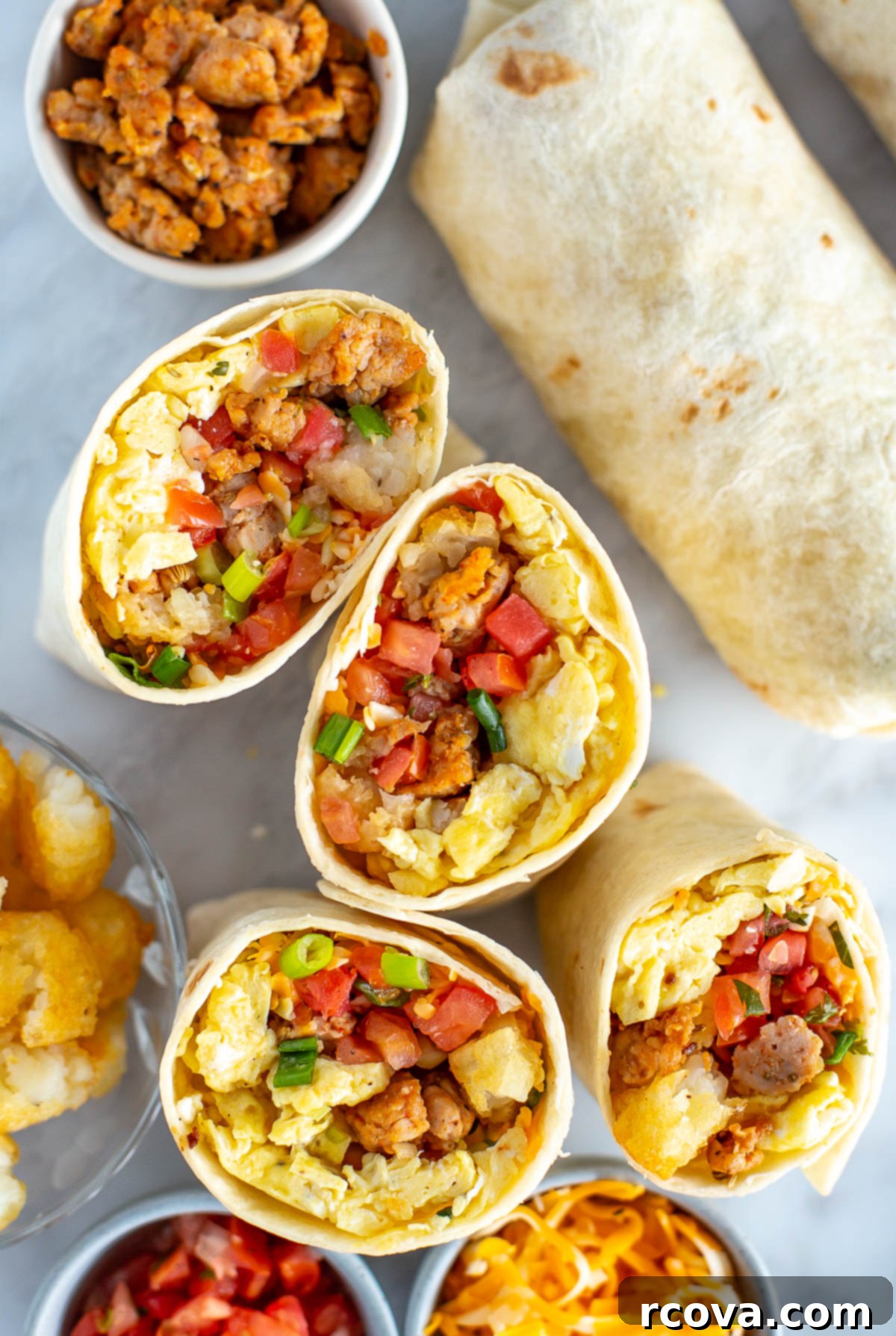 Ultimate Grab-and-Go Breakfast Burritos 9 Close-up overhead shot of a perfectly toasted breakfast burrito, sliced in half.