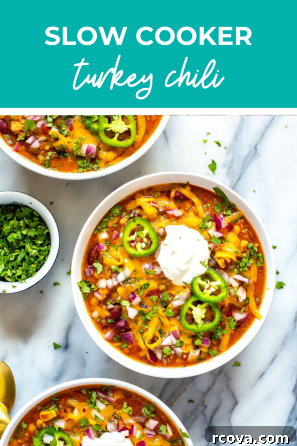 Lean & Hearty Slow Cooker Turkey Chili 11 Two bowls prepared with healthy turkey chili topped with fresh sliced jalapenos.