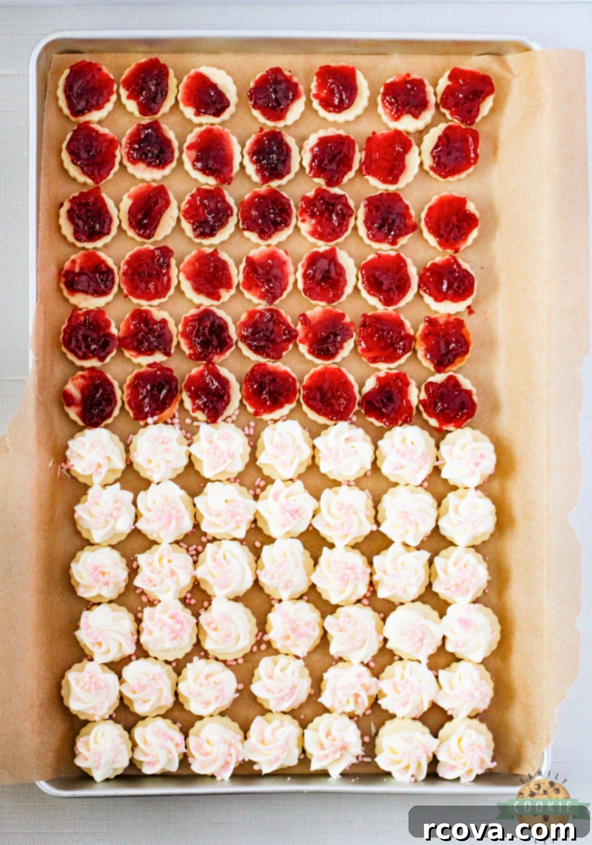 Imperial Delights 11 Filling empire cookies with raspberry jam and topping with buttercream frosting.