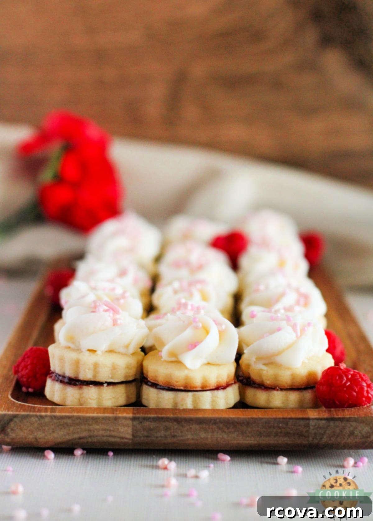 Imperial Delights 14 Shortbread cookie sandwiches filled with raspberry jam and topped with buttercream frosting.