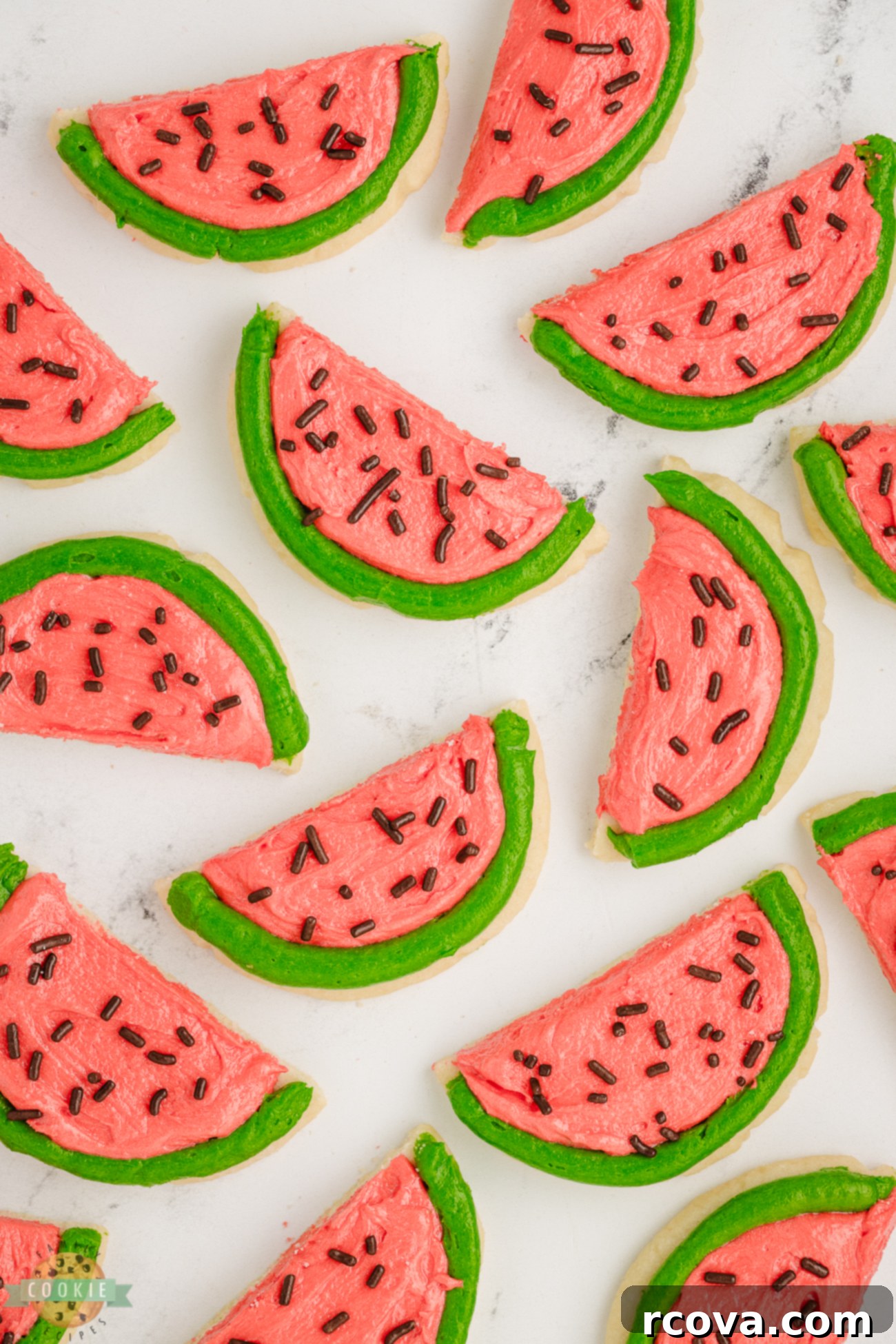 Summer Kissed Watermelon Cookies 4 half-circle watermelon slice cookies arranged artfully on a plate