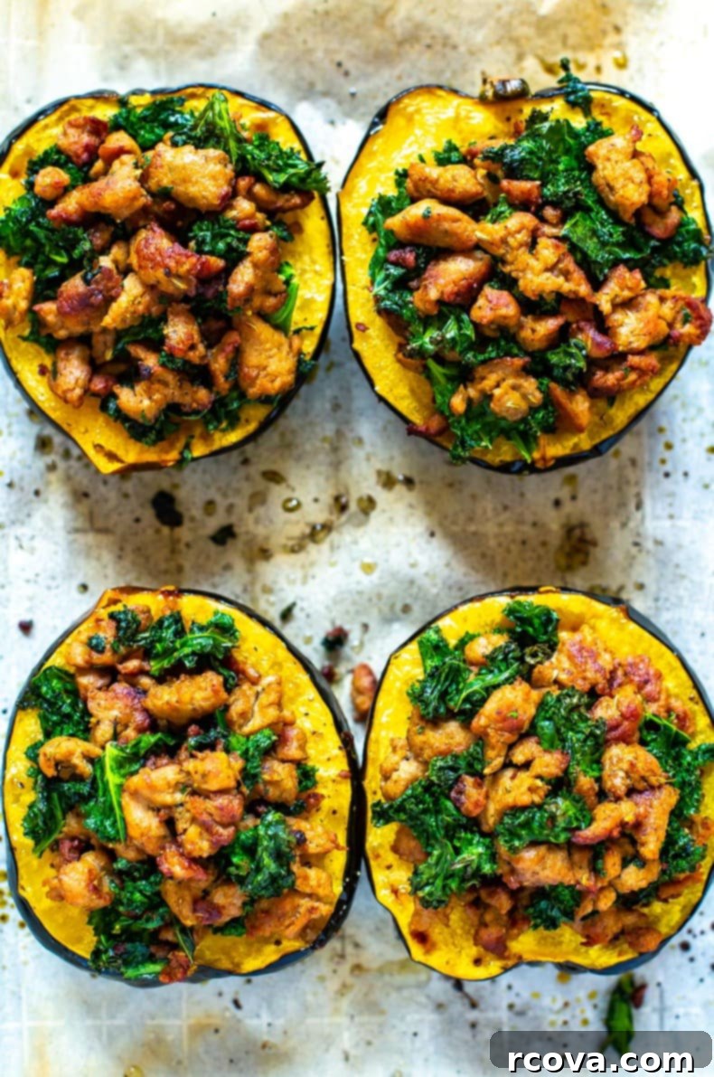 Savory Sausage and Kale Stuffed Acorn Squash 9 Close-up of a golden-brown acorn squash half, generously stuffed with a hearty mixture of ground turkey and vibrant green kale.
