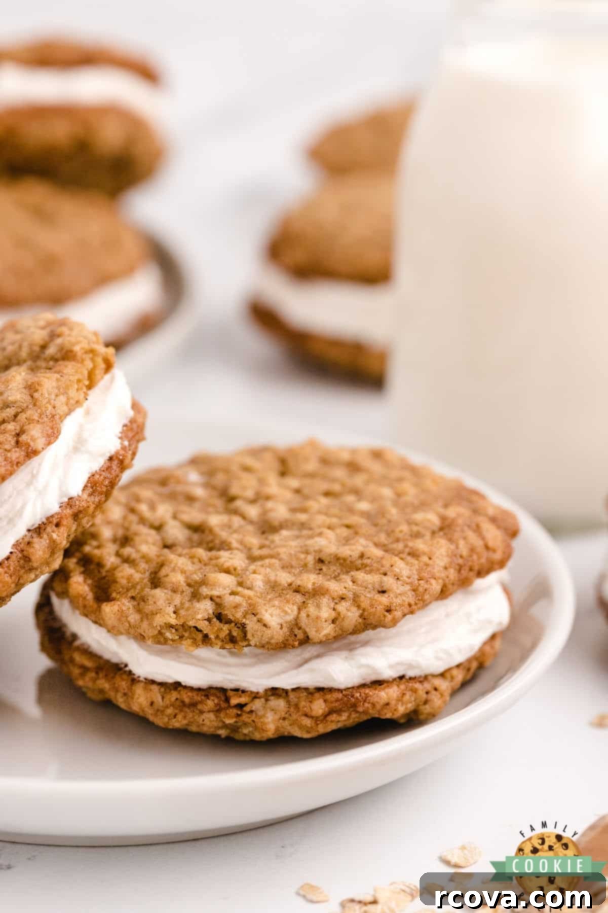 Dreamy Oatmeal Cream Cookies 12 Homemade oatmeal cream pies cooling on a rack after baking, showing their golden brown edges and soft centers