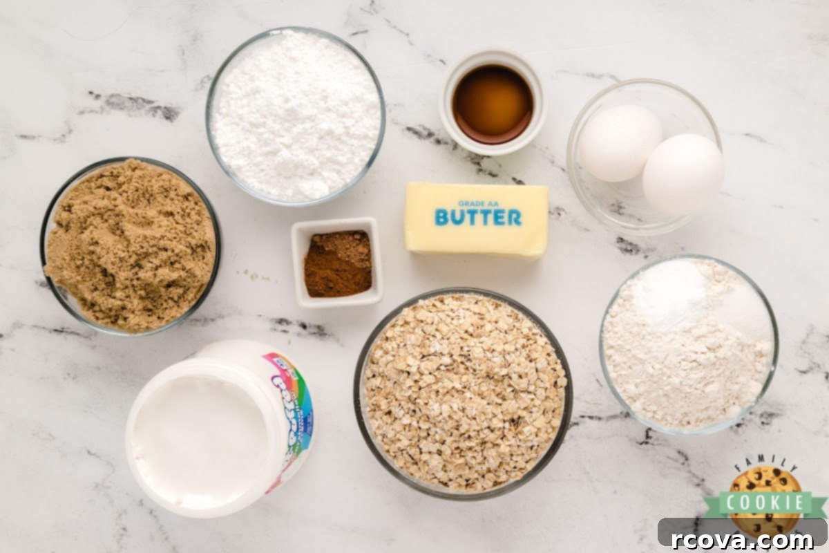 Dreamy Oatmeal Cream Cookies 5 All the dry and wet ingredients for the oatmeal cookie recipe, including flour, spices, oats, butter, sugar, and eggs