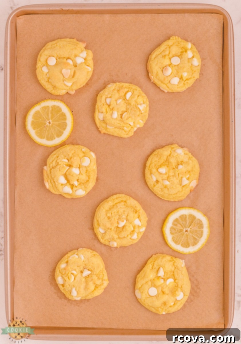 Velvet White Chocolate Lemon Dreams 4 Soft and chewy lemon pudding cookies stacked on a plate.