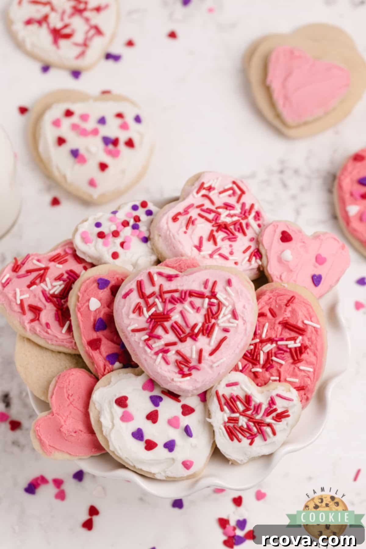 Love-Infused Sugar Delights 13 A festive plate filled with heart-shaped, frosted Valentine's Sugar Cookies, ready to be enjoyed.