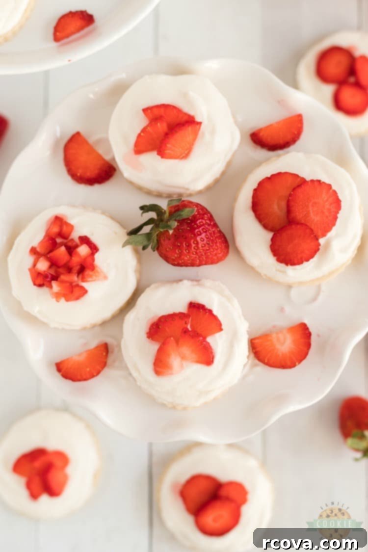 Sweet Valentine's Cookie Creations 12 Delicious Strawberry Shortcake Cookies, topped with whipped cream and fresh sliced strawberries, a perfect dessert fusion.