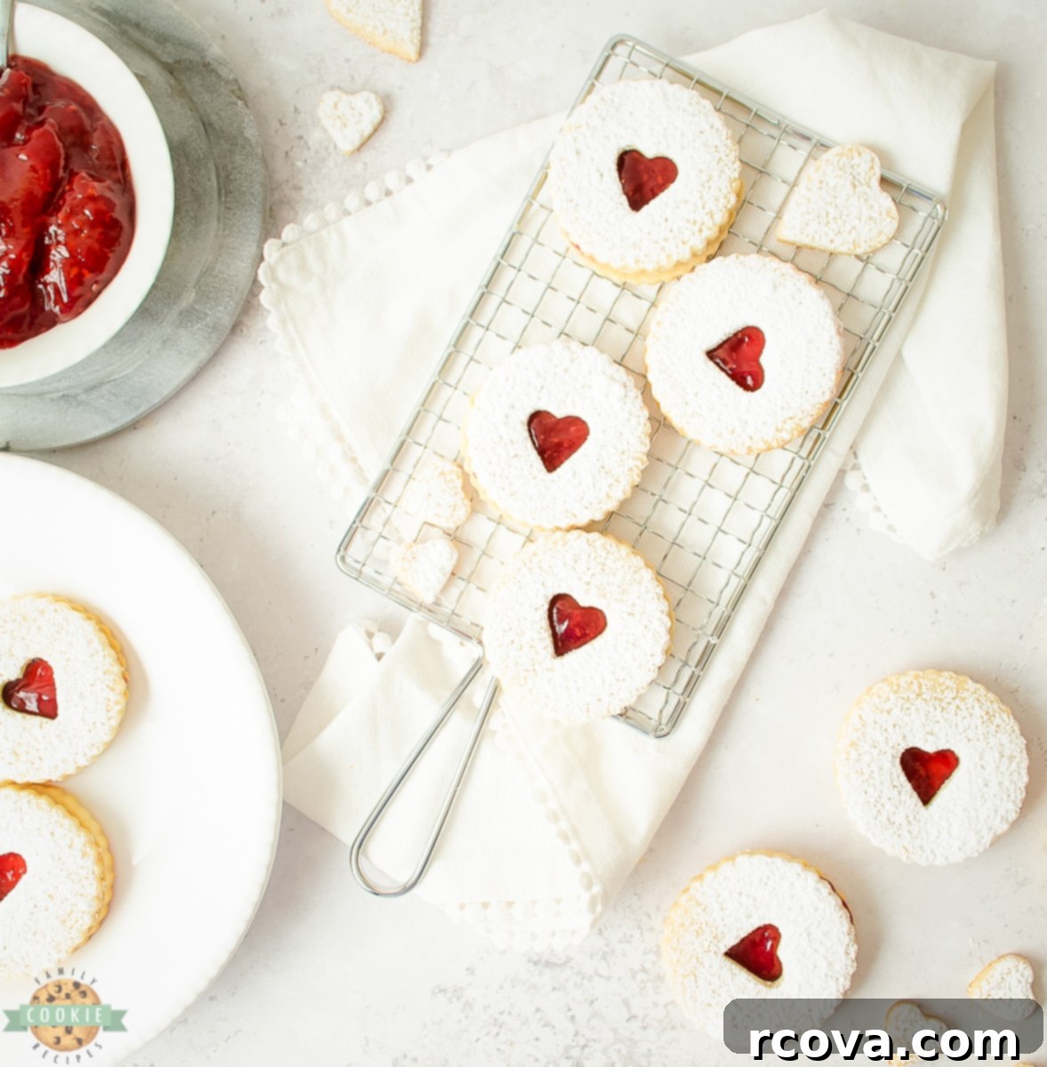 Sweet Valentine's Cookie Creations 5 Homemade Linzer Cookies with vibrant raspberry jam filling, featuring a classic cutout design, perfect for gifting.