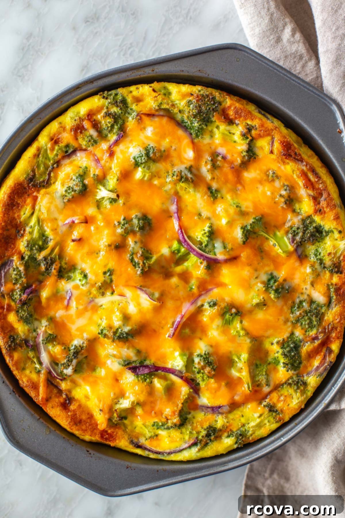 Low Carb Crustless Broccoli Cheddar Quiche 8 Close-up of a perfectly baked Crustless Broccoli Cheddar Quiche, showcasing its fluffy texture and golden-brown top.