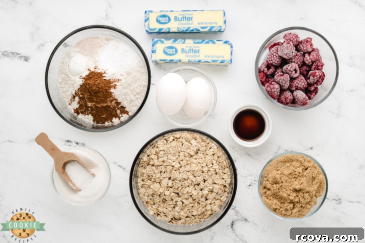 Chewy Raspberry Oatmeal Cookies 3 Essential ingredients for making Raspberry Oatmeal Cookies, featuring butter, sugars, eggs, flour, oats, and vibrant raspberries.