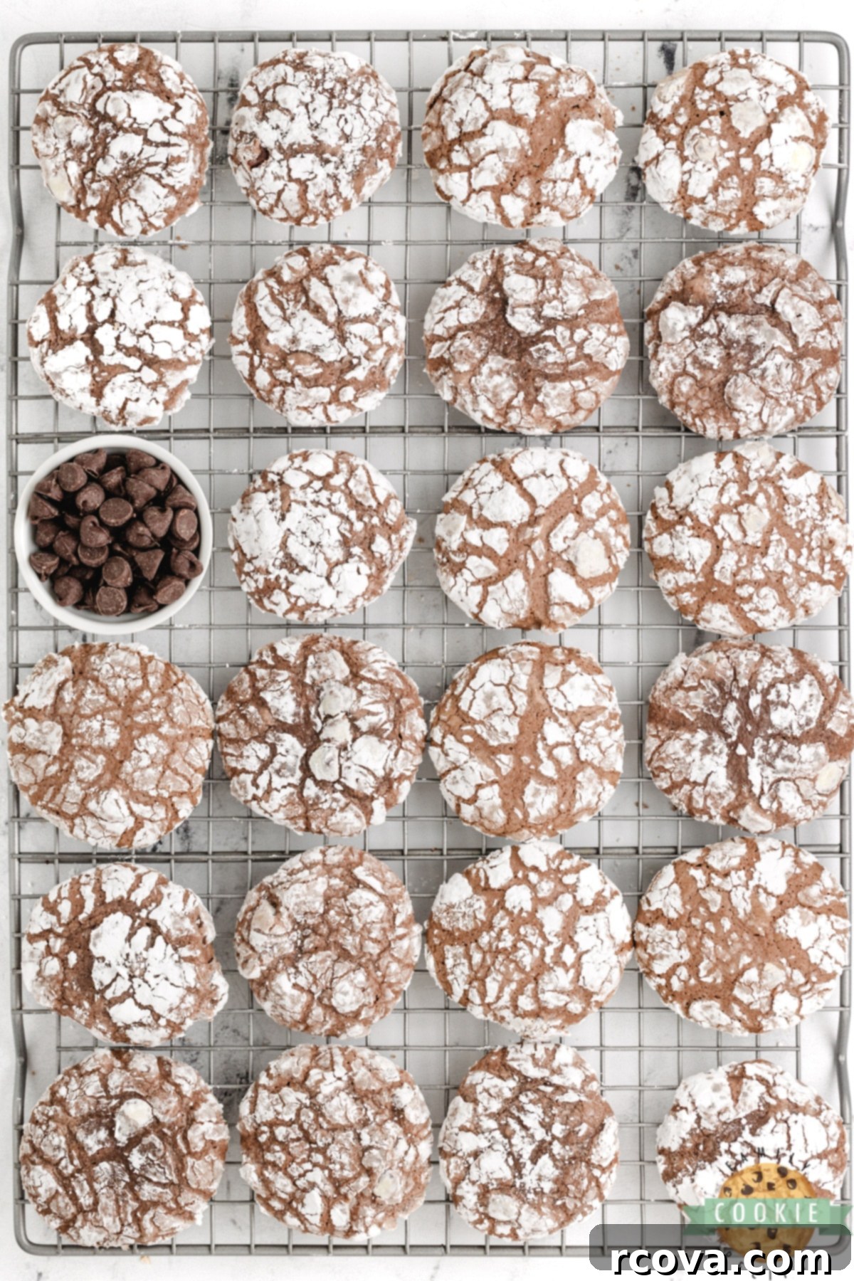 Fudgy Brownie Crinkles 9 Brownie cookies cooling on a wire rack.