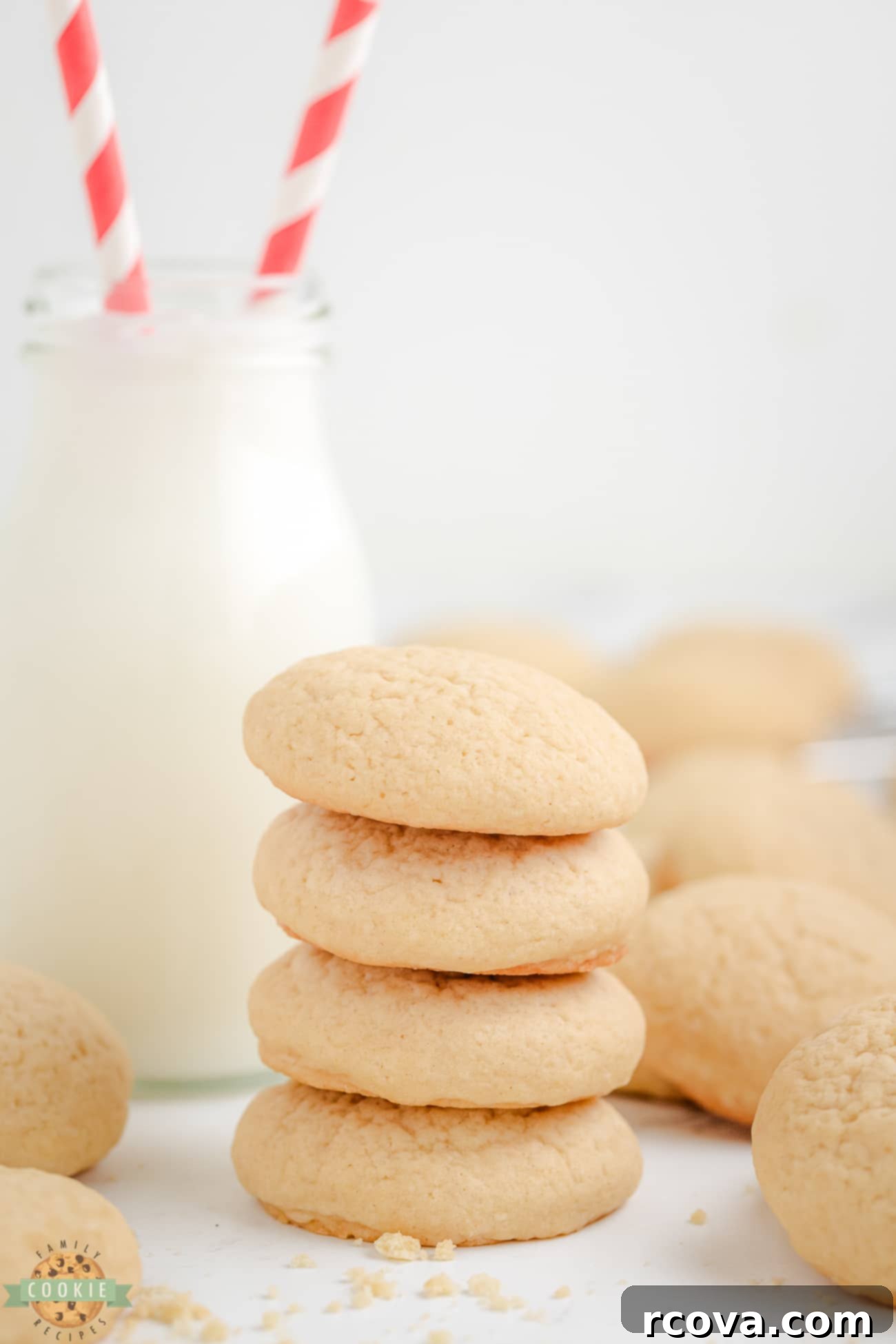 Homemade Nilla Wafers 3 A stack of golden brown homemade copycat Nilla wafer cookies next to a glass of milk, ready for dipping.