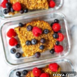 Ultimate Baked Oatmeal 9 Close-up of baked oatmeal with fresh berries and maple syrup