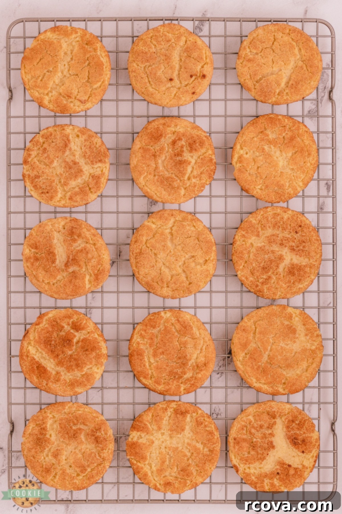 The Ultimate Snickerdoodle Recipe 6 Snickerdoodle cookies cooling on a wire rack