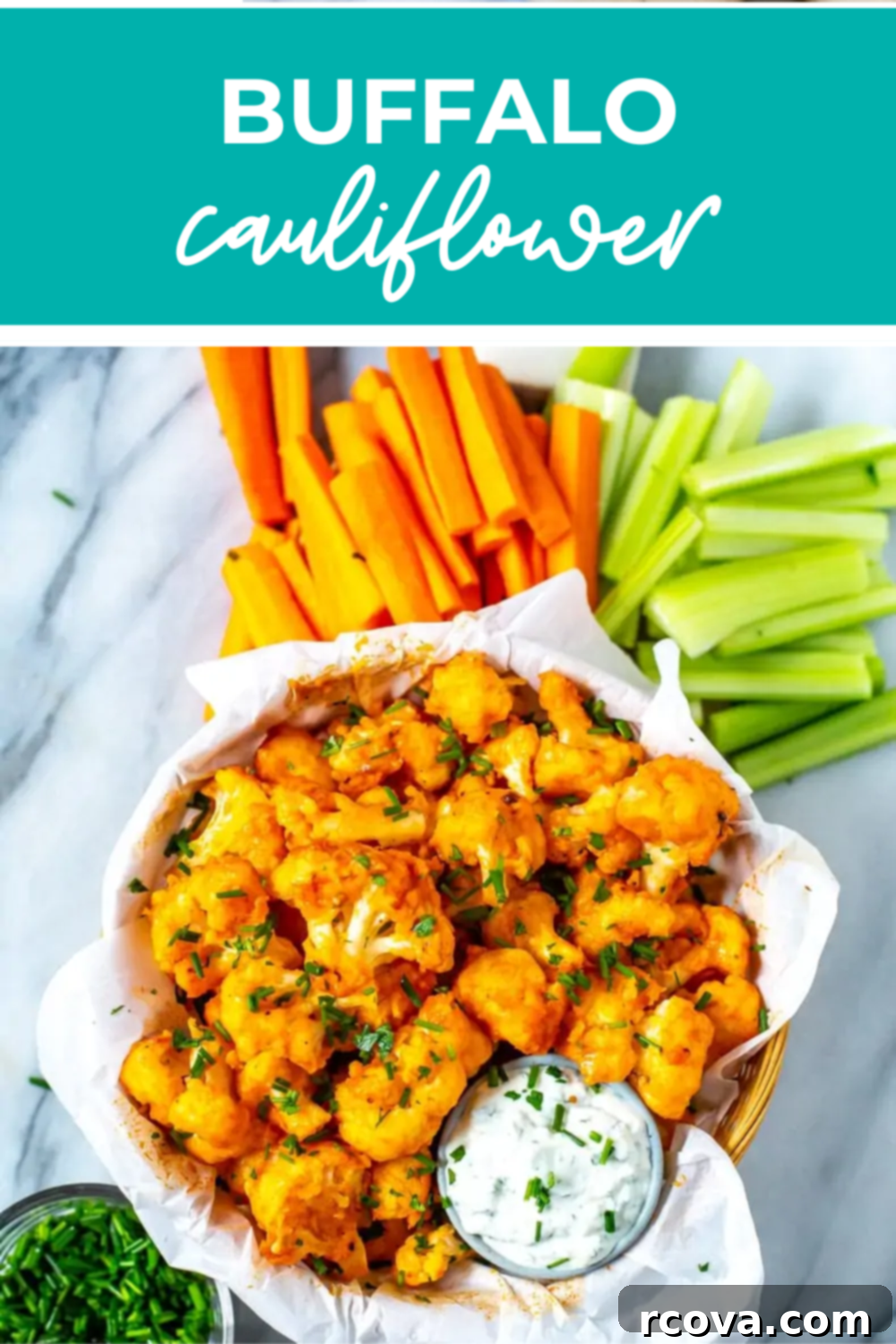 Spicy Baked Buffalo Cauliflower Wings 13 Overhead shot of bowl of buffalo cauliflower with carrots and celery for dipping.