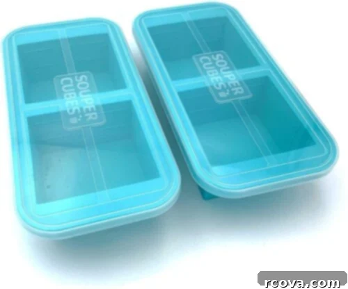The Ultimate Guide to Meal Prep Containers 11 Souper Cubes 2-Cup Extra-Large Silicone Freezer Tray with Lid - 2 pack, shown filled with frozen portions of food.