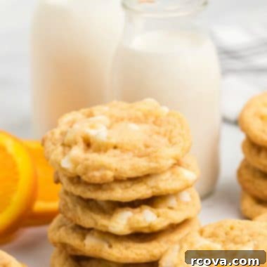 Zesty Orange Creamsicle Delights 9 Orange Creamsicle Cookies are creamsicles in cookie form! Soft & chewy cookies with bright orange flavor and sweet white chocolate chips.
