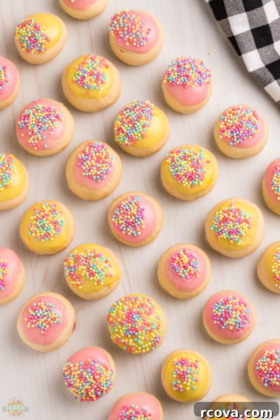 Classic Frosted Italian Cookies 10 A plate of freshly baked Frosted Italian Cookies with sprinkles, ready to be enjoyed.
