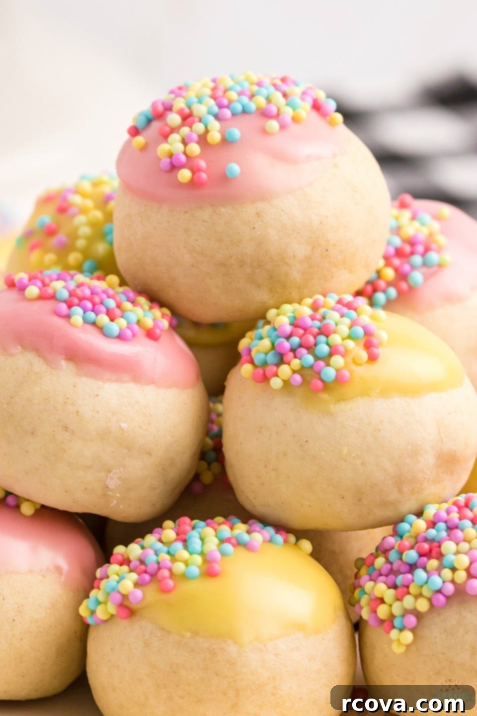 Classic Frosted Italian Cookies 11 Stacked Frosted Italian Cookies in a festive setting.