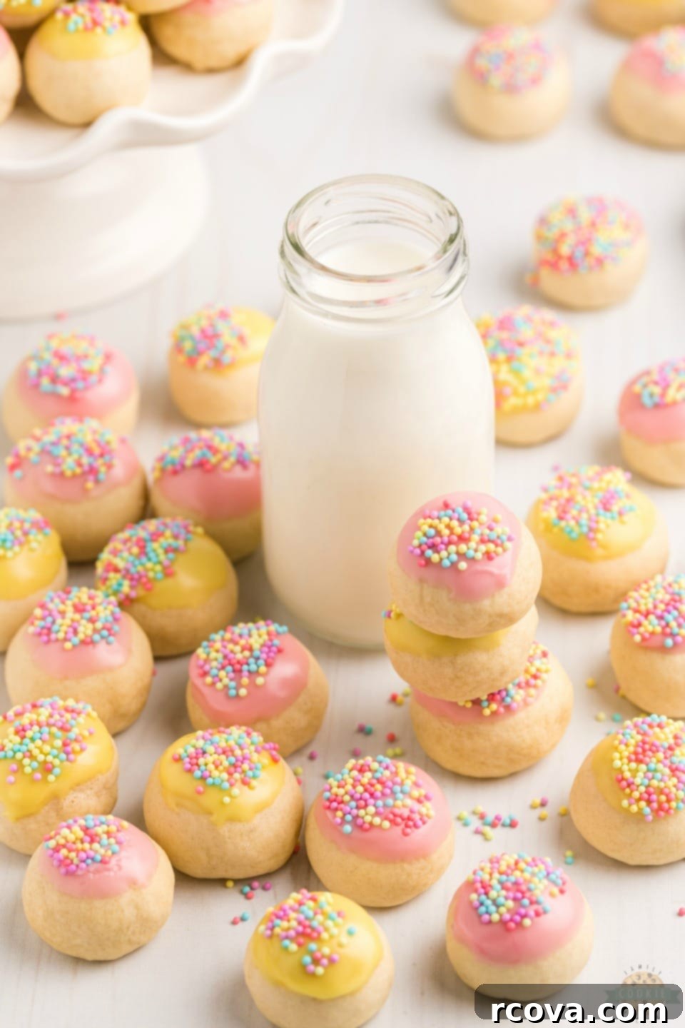 Classic Frosted Italian Cookies 8 A batch of finished Frosted Italian Cookies with colorful sprinkles.