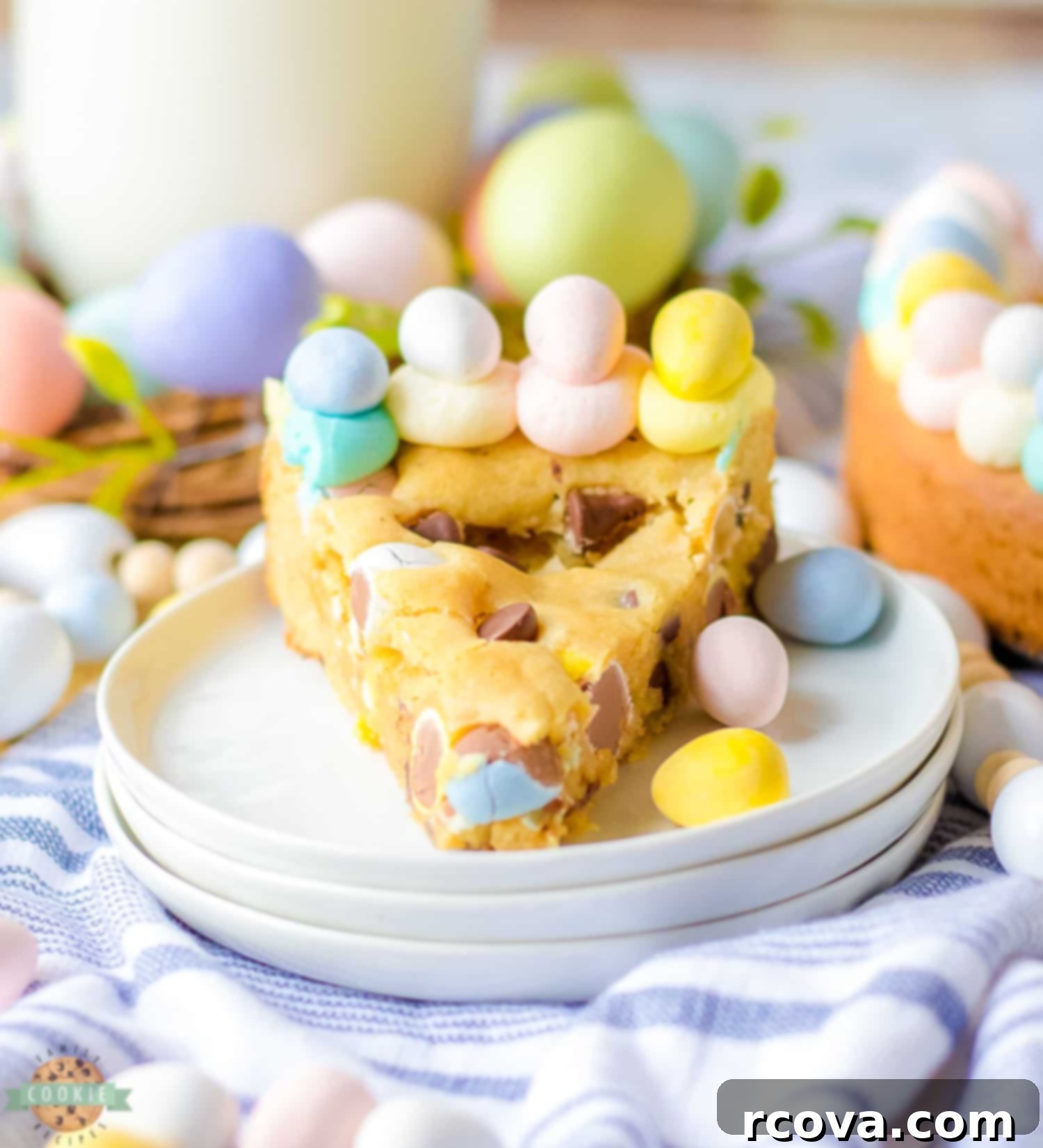 Spring Cookie Delights 19 Easter Chocolate Chip Cookie Cake with pastel frosting and chocolate eggs.