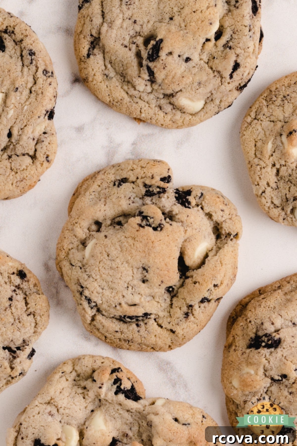 Cookies and Cream Crumble Cookies 11 A close-up shot of a hand holding a freshly baked Cookies and Cream Cookie, highlighting its soft texture and inviting appearance.