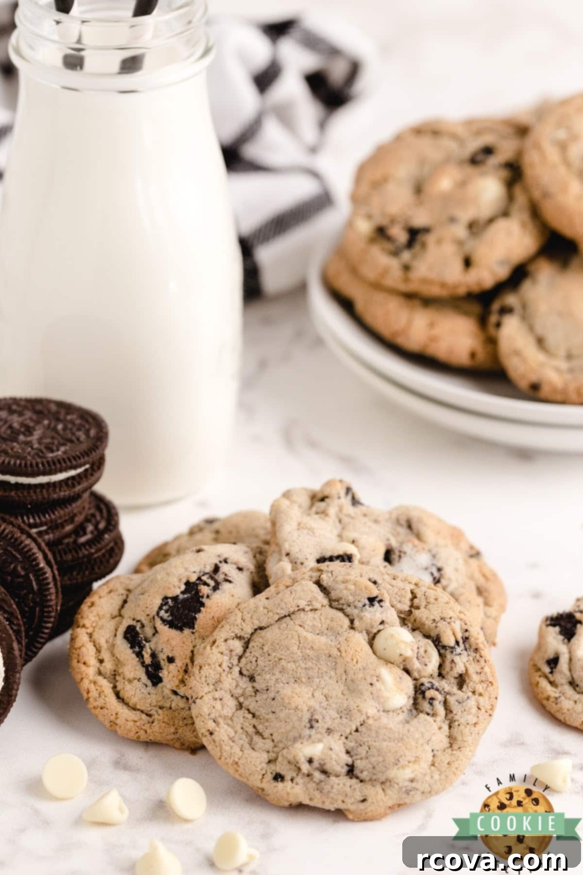 Cookies and Cream Crumble Cookies 12 A delicious close-up of a stack of Cookies and Cream Cookies with white chocolate chips visible, emphasizing their appealing texture.