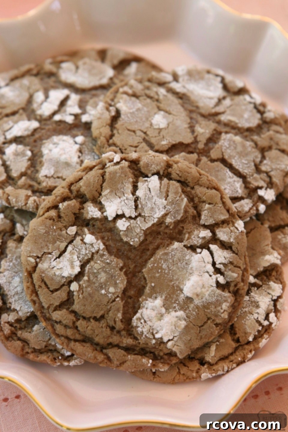 Cozy Cinnamon Chocolate Crinkles 8 Stacked Cinnamon Chocolate Crinkle Cookies on a cooling rack