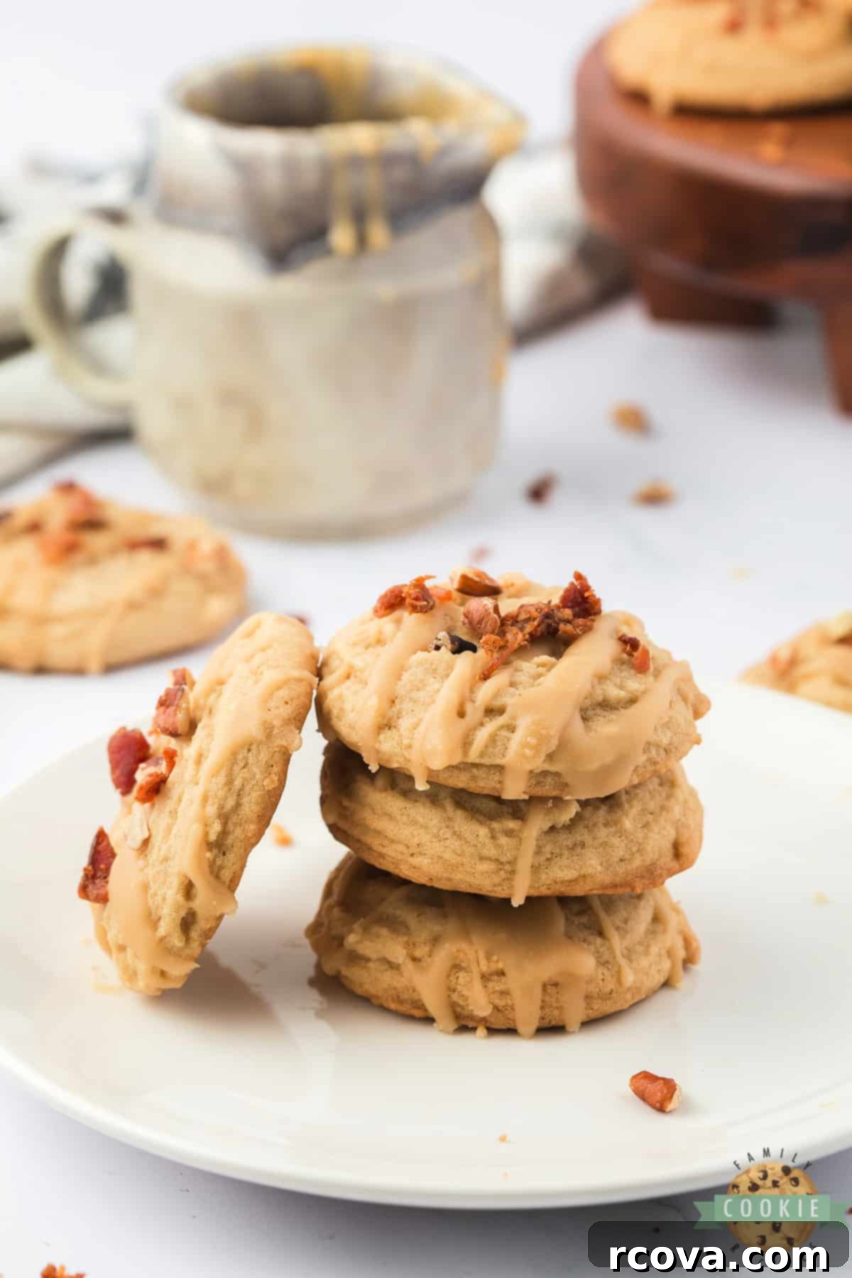 Sweet & Savory Maple Bacon Cookies 14 A close-up of a single Maple Bacon Cookie, perfectly glazed and topped with crisp bacon pieces, ready to be enjoyed.