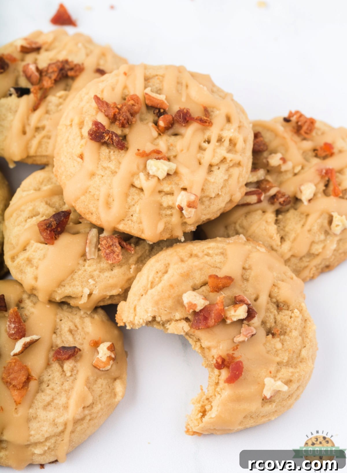 Sweet & Savory Maple Bacon Cookies 3 Freshly baked maple bacon cookies cooling on a rack, highlighting their golden brown edges and soft centers.