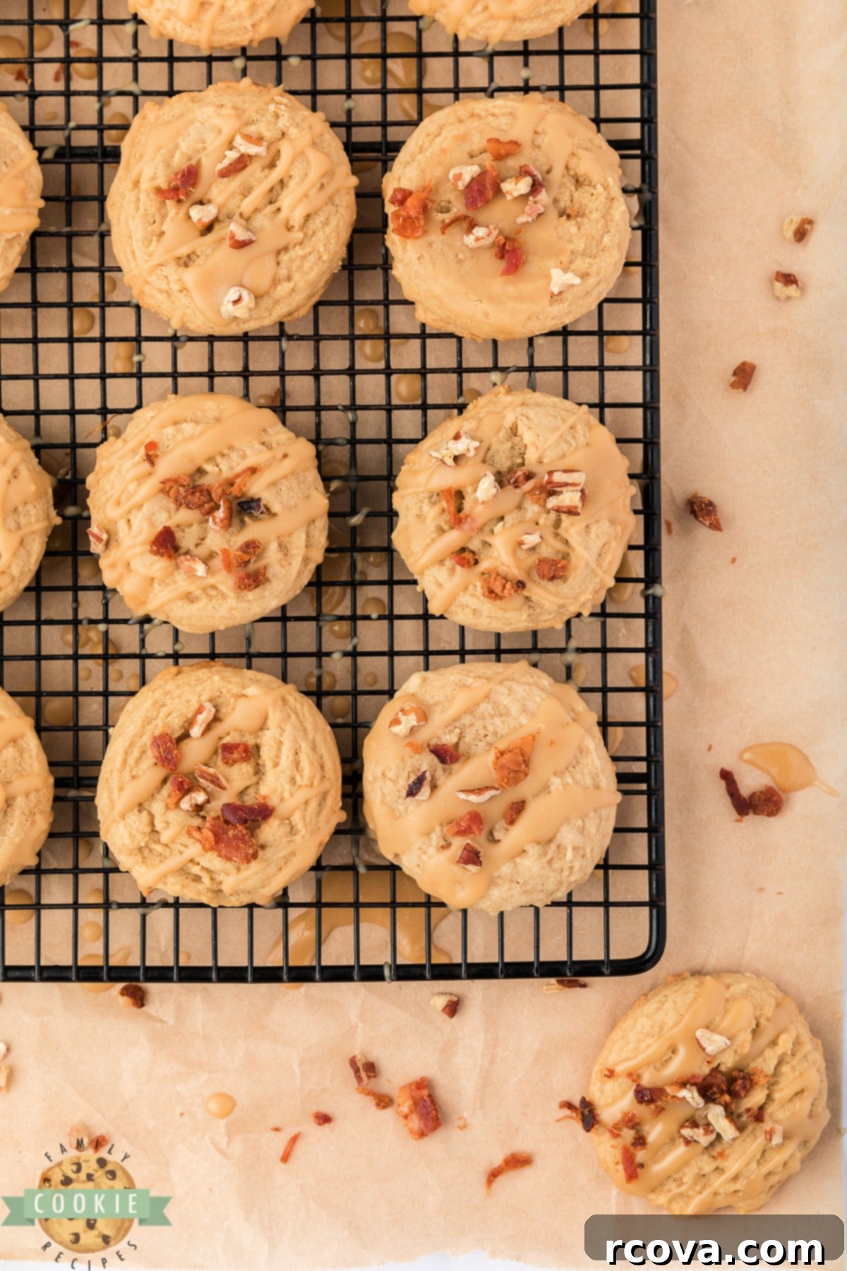 Sweet & Savory Maple Bacon Cookies 5 Drizzling rich maple glaze over freshly baked Maple Bacon Cookies, topped with crispy crumbled bacon, on a cooling rack.